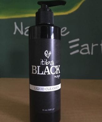 Bottle of itiba Black magic liquid cleanser for men's skincare